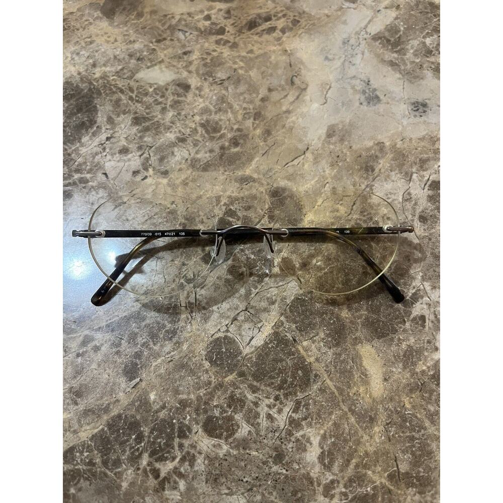 Marchon Airlock 2 - 770/39 RIMLESS EYEGLASSES 47-21-135 color 015 Tortoise‎
